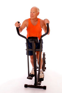 Older man on eliptical machine